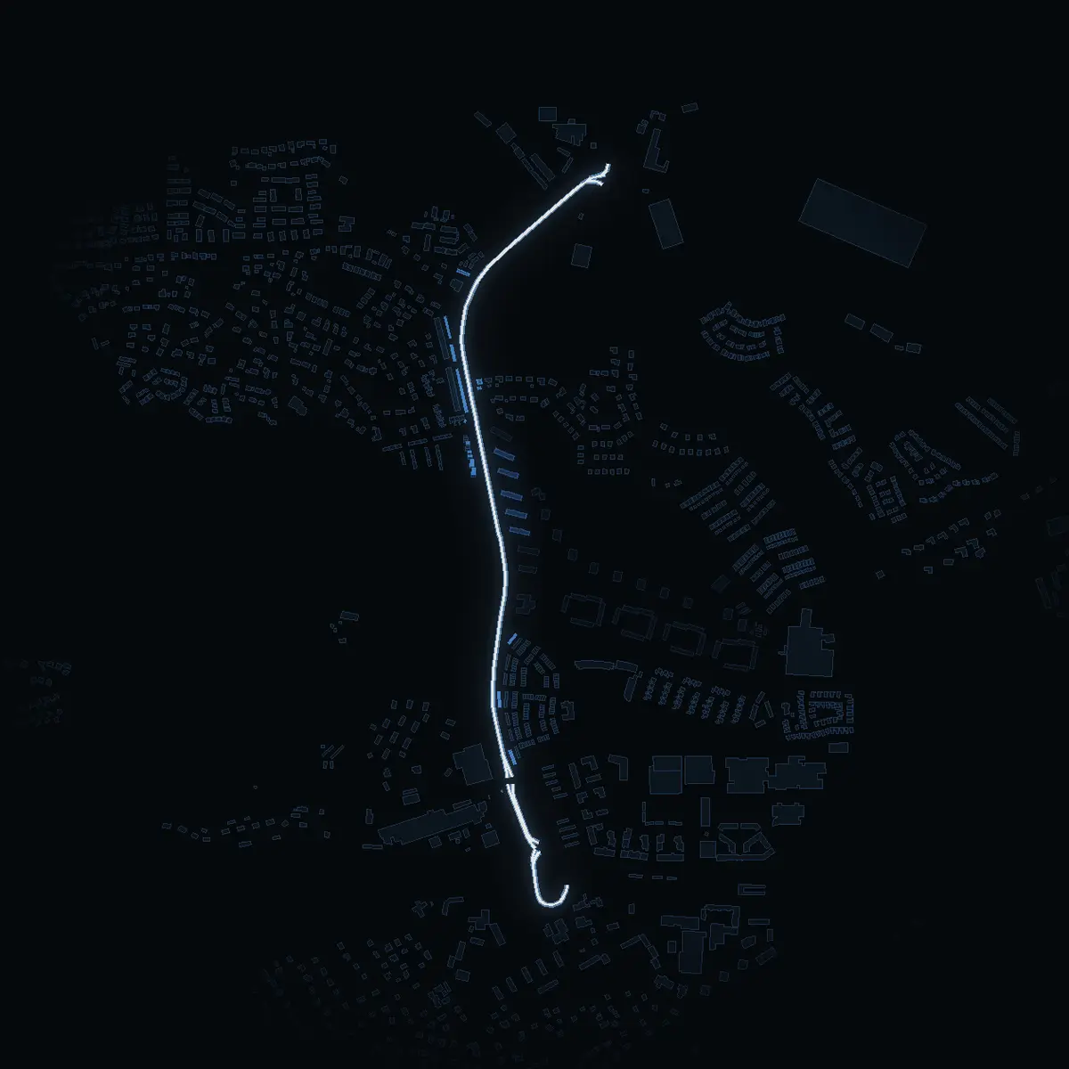 The street at night: Tumbavägen drawn in white, its buildings lit in the colour of their area’s income