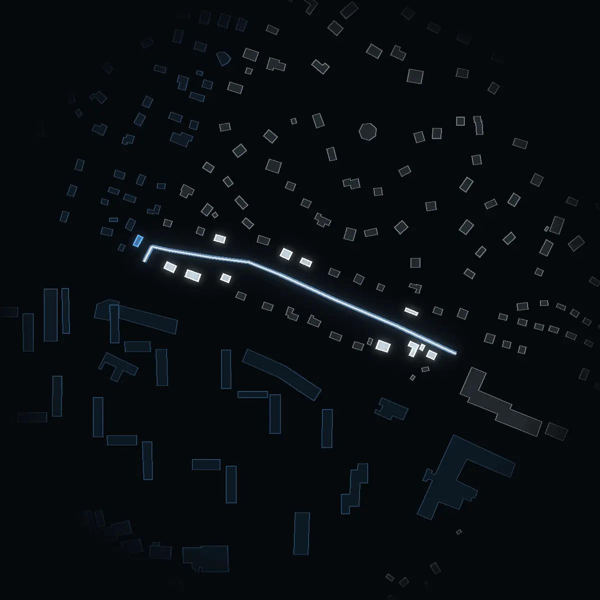 The street at night: Anundvägen drawn in white, its buildings lit in the colour of their area’s income