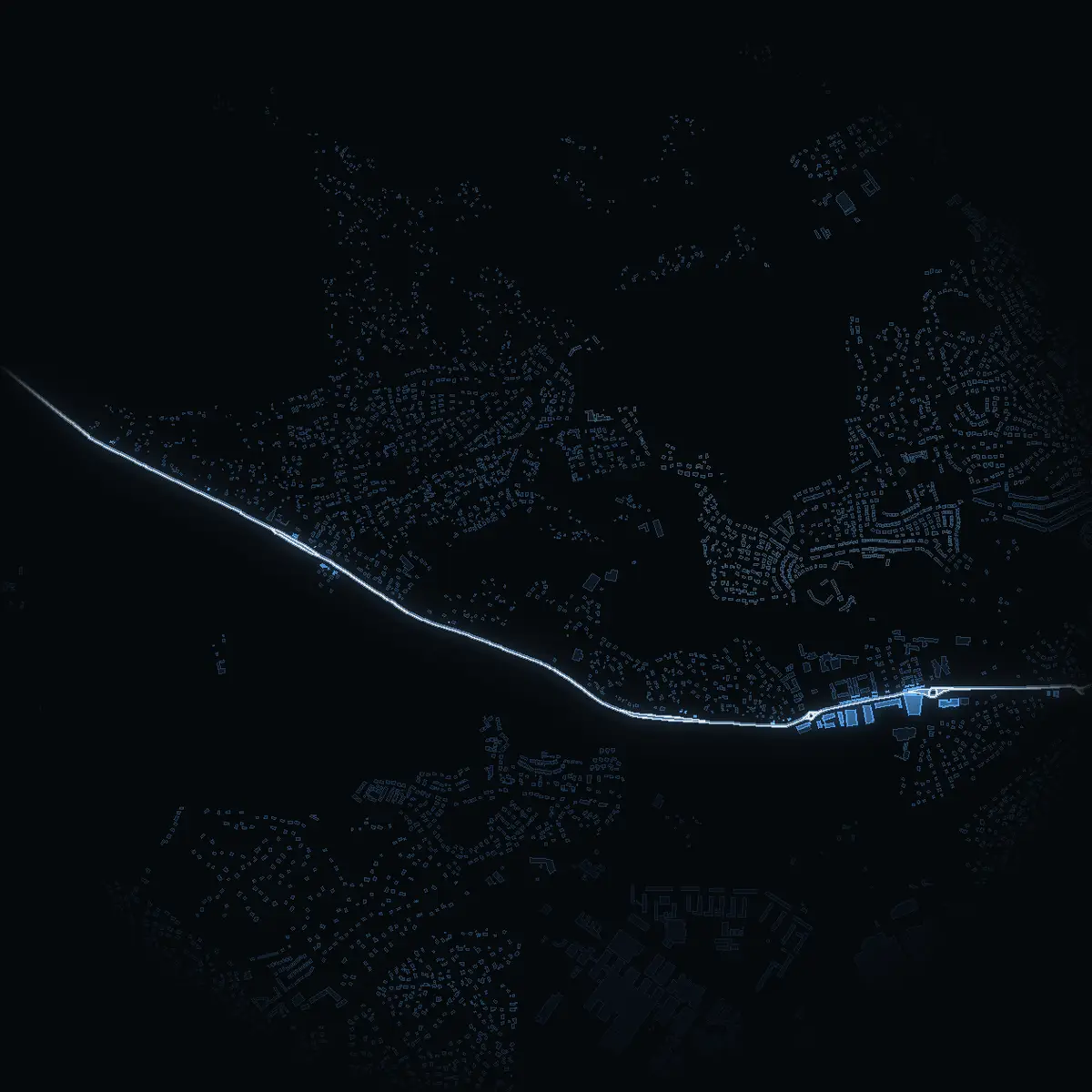 The street at night: Glömstavägen drawn in white, its buildings lit in the colour of their area’s income