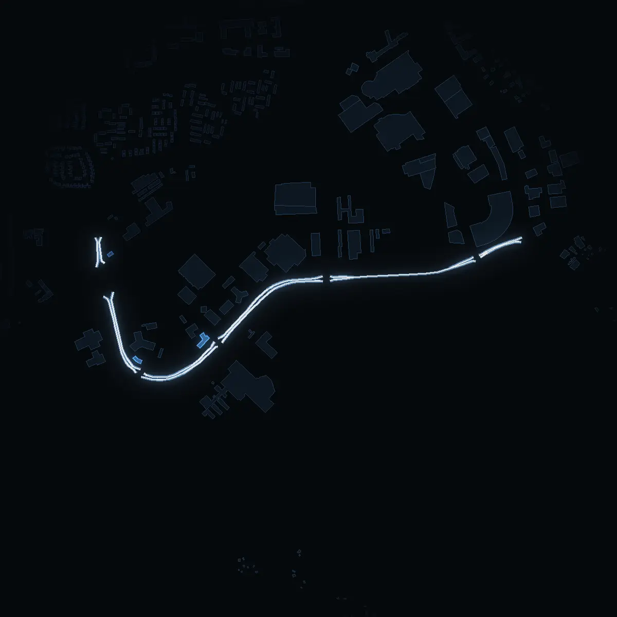 The street at night: Kungens Kurvaleden drawn in white, its buildings lit in the colour of their area’s income