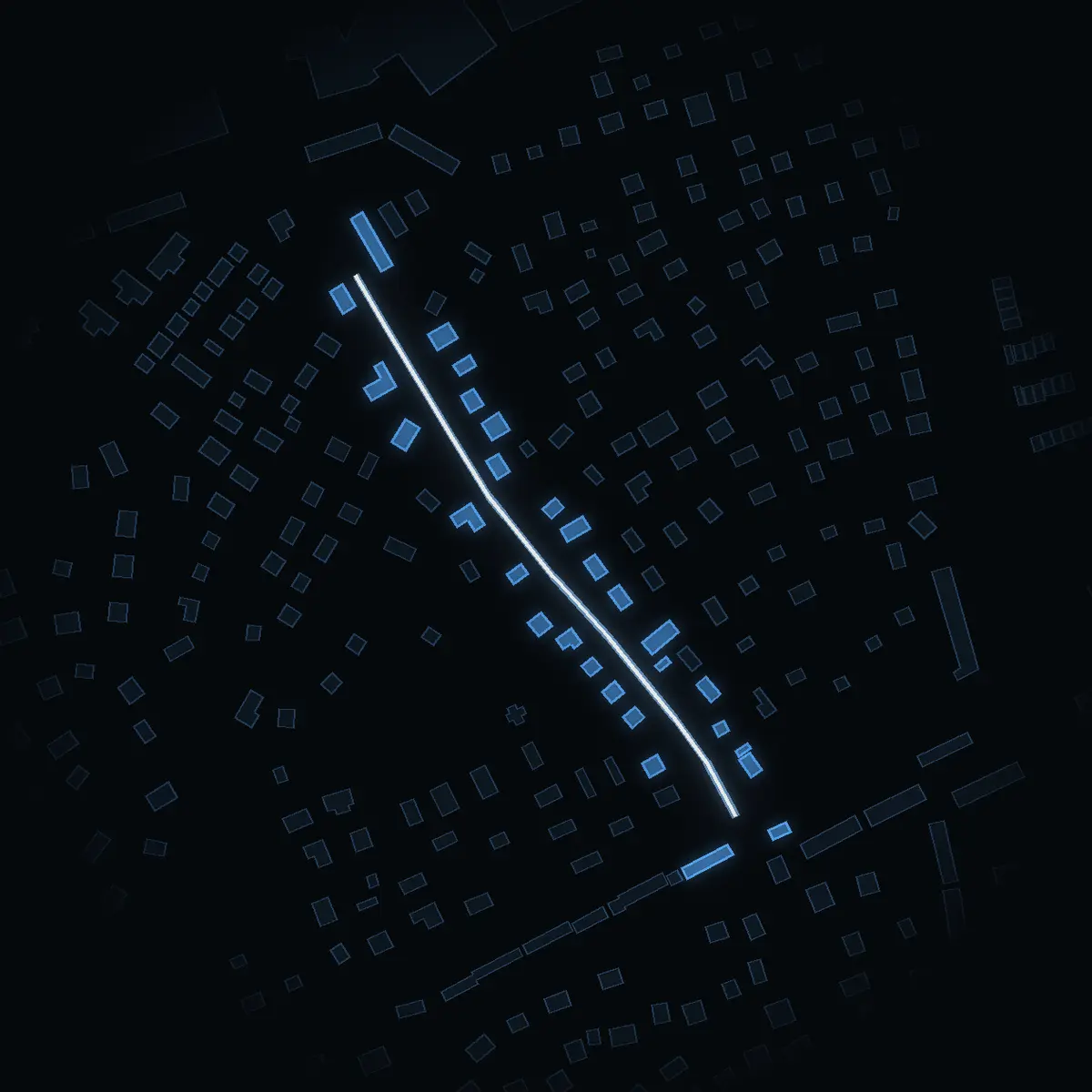 The street at night: Verkstadsvägen drawn in white, its buildings lit in the colour of their area’s income
