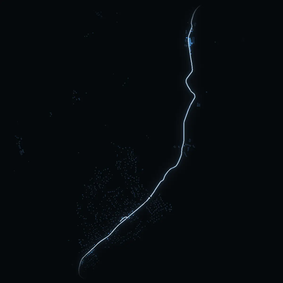 The street at night: Vidjavägen drawn in white, its buildings lit in the colour of their area’s income