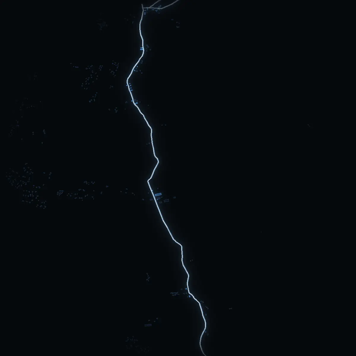 The street at night: Vängsjöbergsvägen drawn in white, its buildings lit in the colour of their area’s income