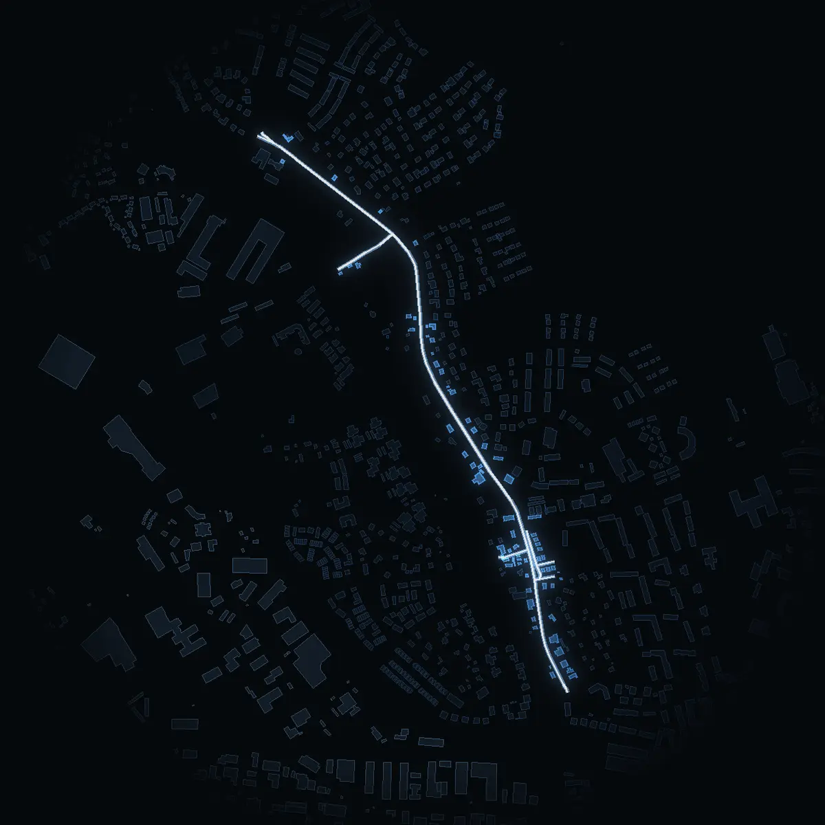 The street at night: Centralvägen drawn in white, its buildings lit in the colour of their area’s income