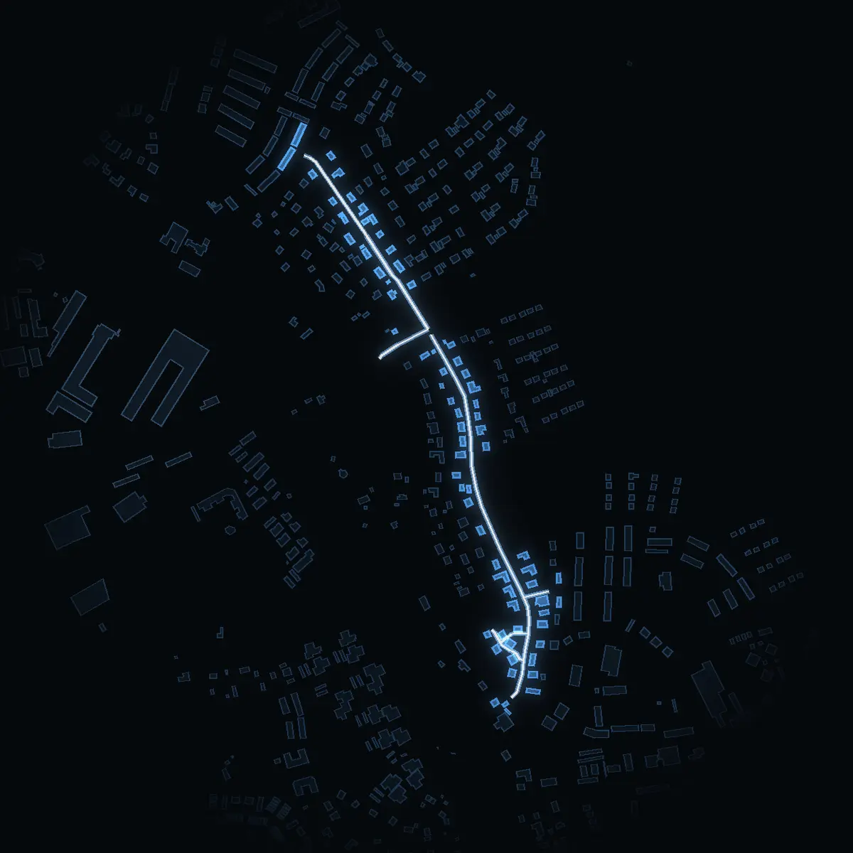 The street at night: Ekbacksvägen drawn in white, its buildings lit in the colour of their area’s income