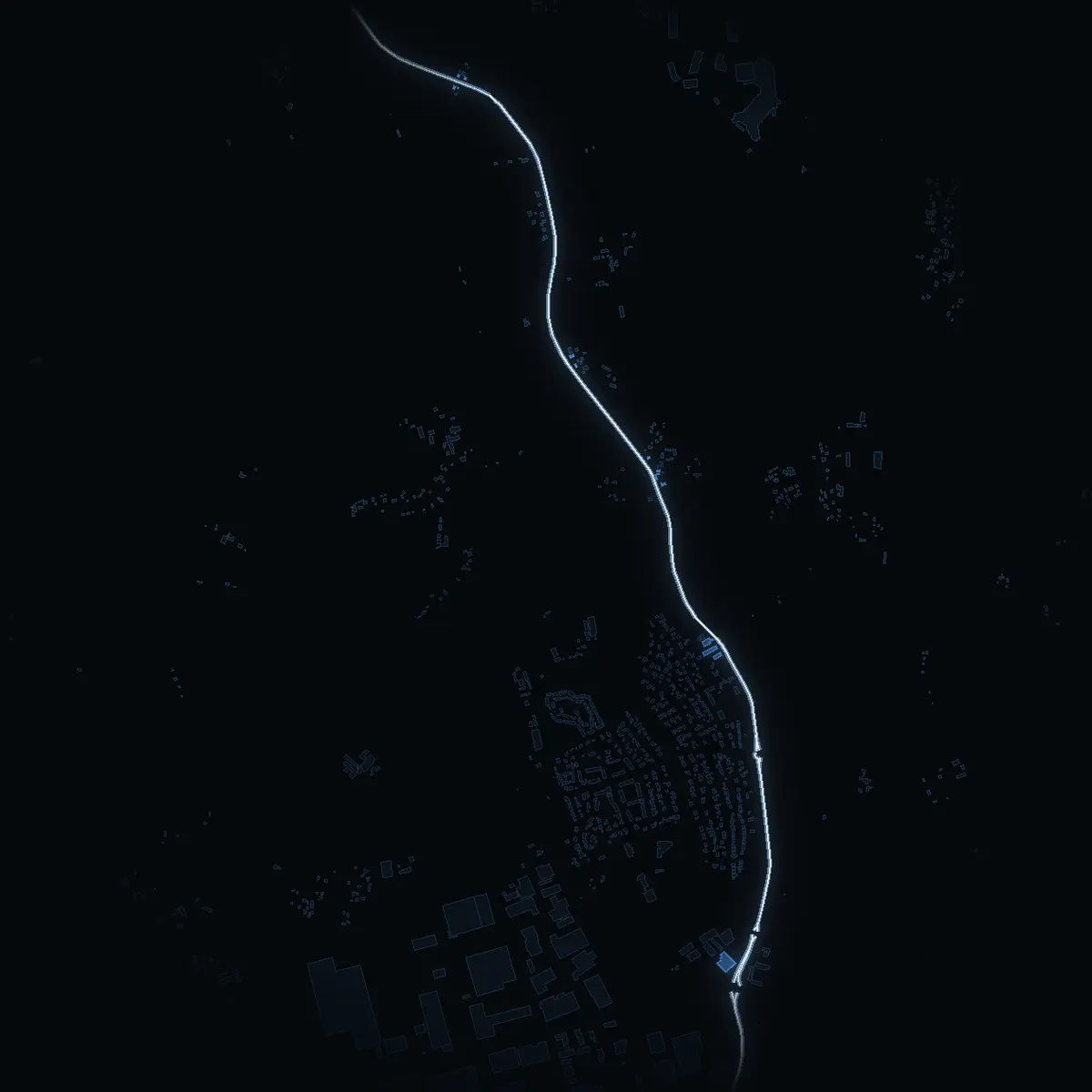 The street at night: Norrsundavägen drawn in white, its buildings lit in the colour of their area’s income