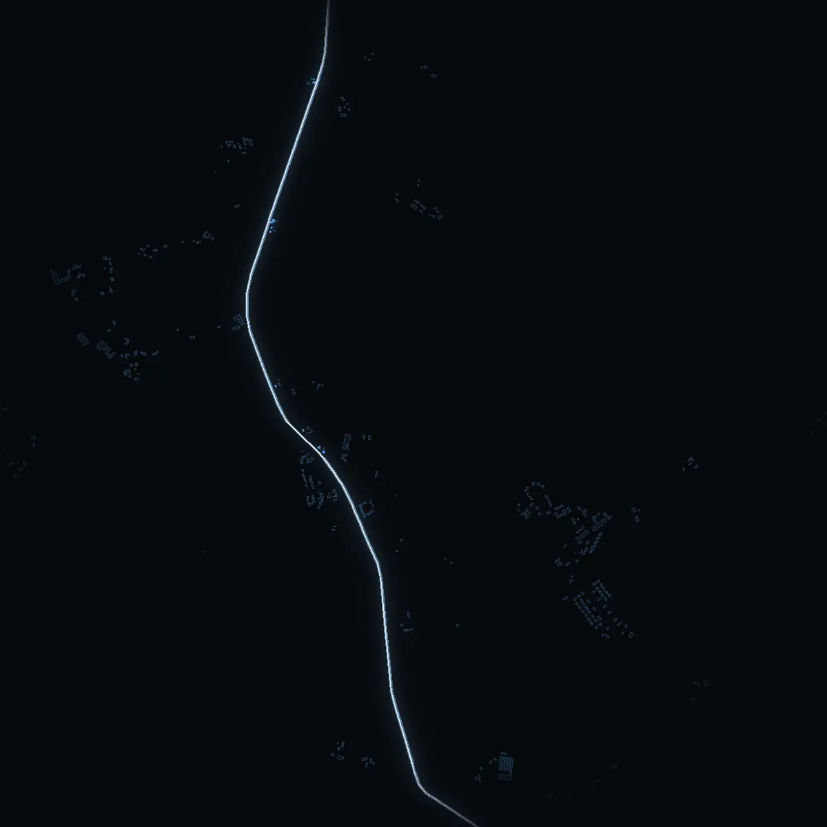 The street at night: Vassundavägen drawn in white, its buildings lit in the colour of their area’s income