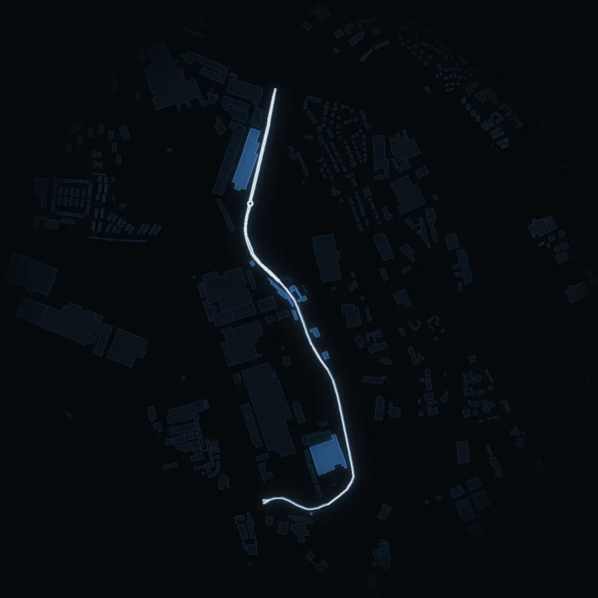 The street at night: Verkstadsvägen drawn in white, its buildings lit in the colour of their area’s income