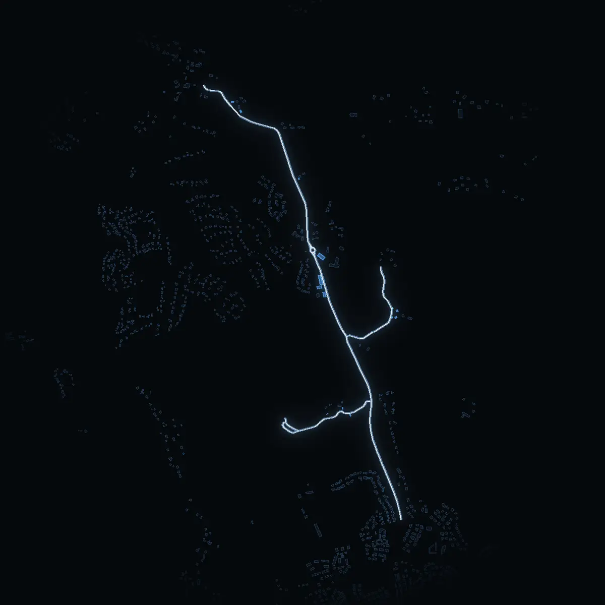 The street at night: Viksbergsvägen drawn in white, its buildings lit in the colour of their area’s income