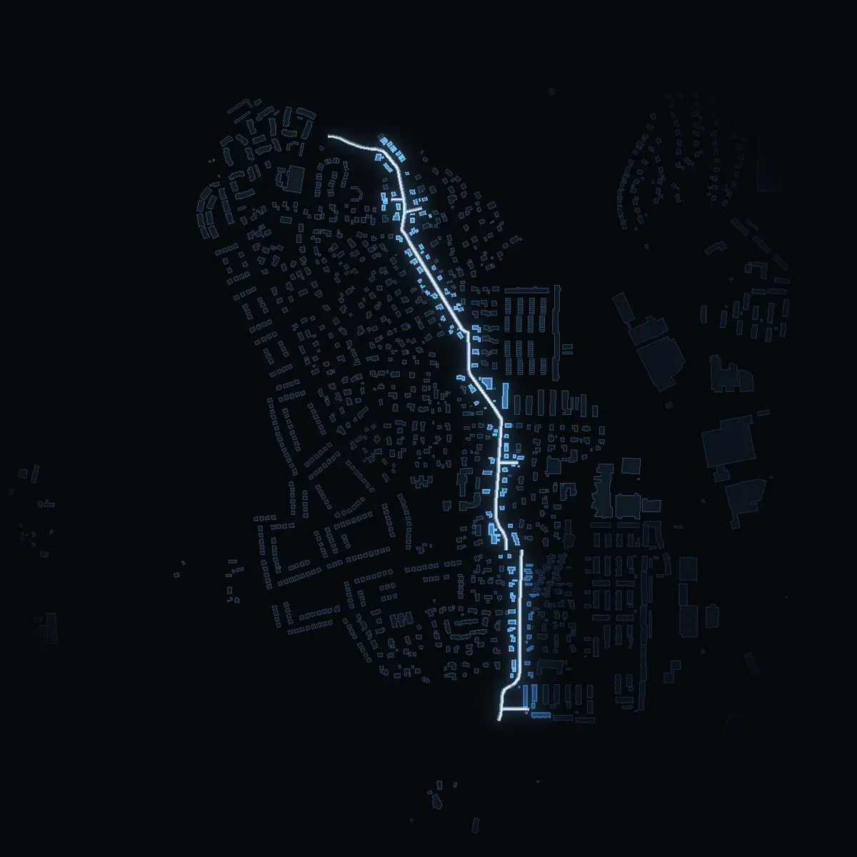 The street at night: Vasavägen drawn in white, its buildings lit in the colour of their area’s income