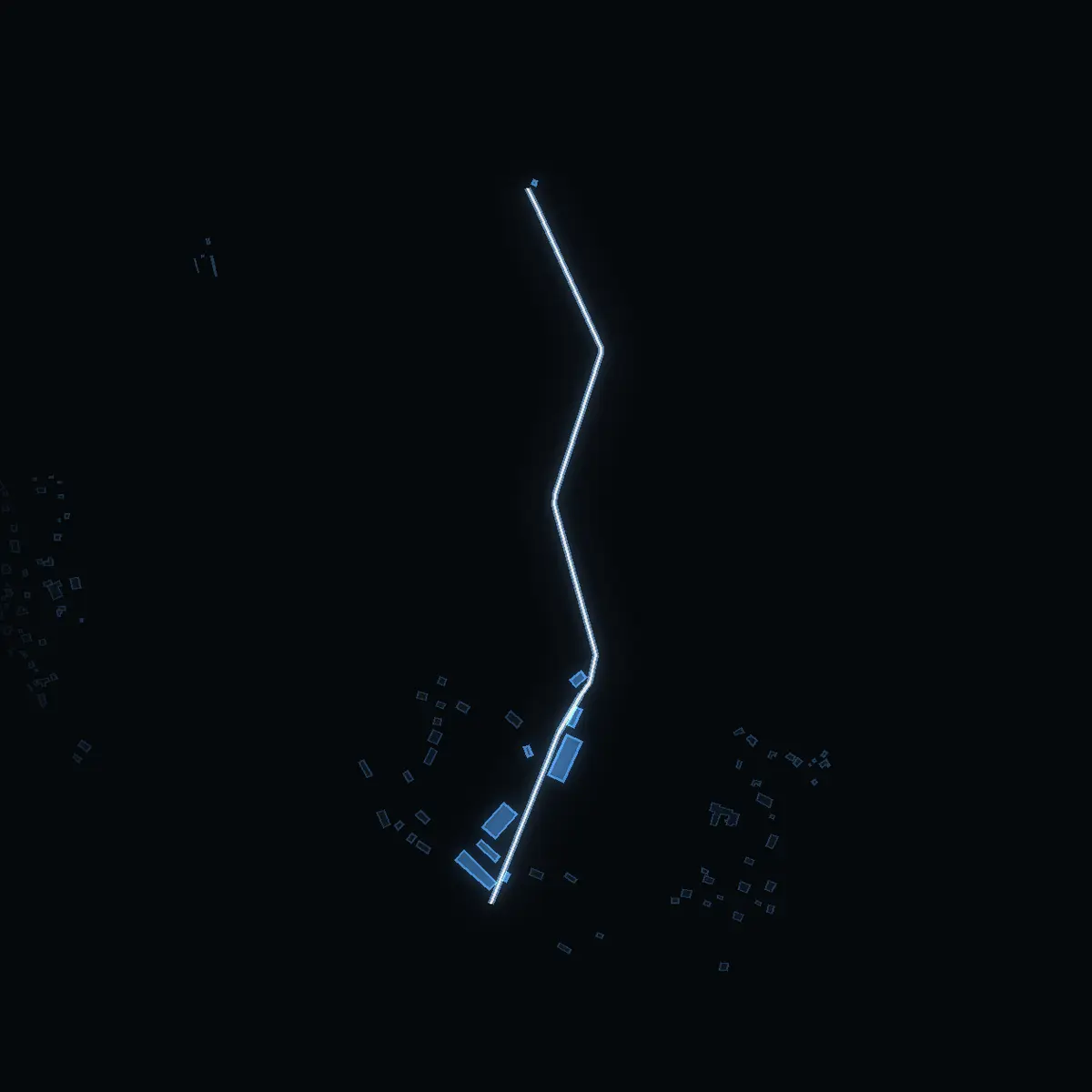 The street at night: Karltomtavägen drawn in white, its buildings lit in the colour of their area’s income
