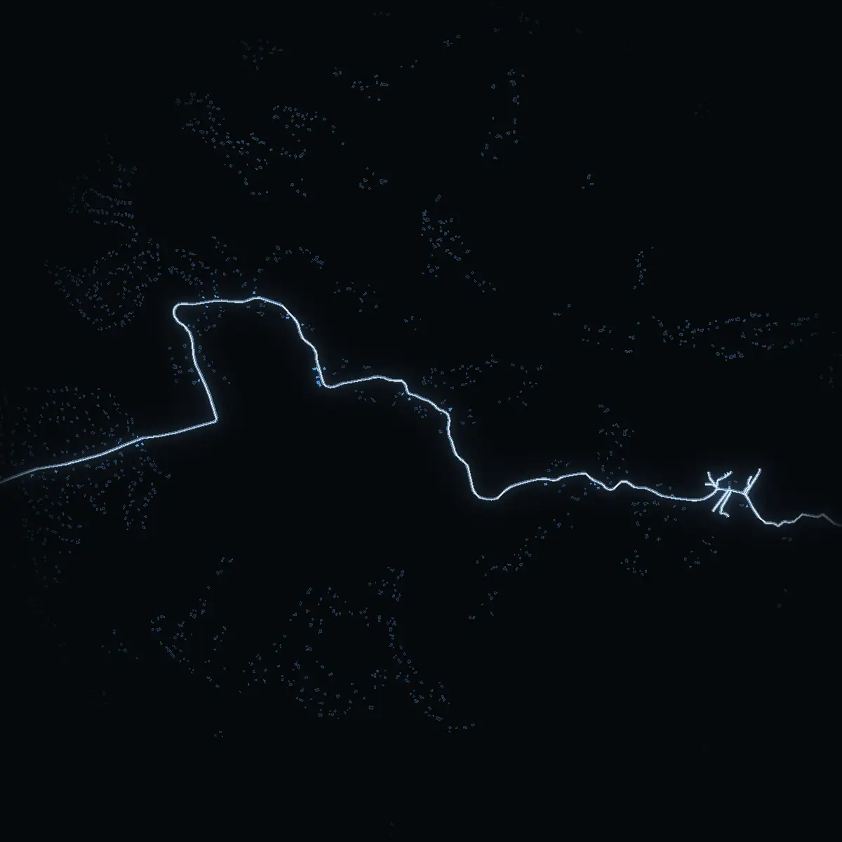 The street at night: Östernäsvägen drawn in white, its buildings lit in the colour of their area’s income