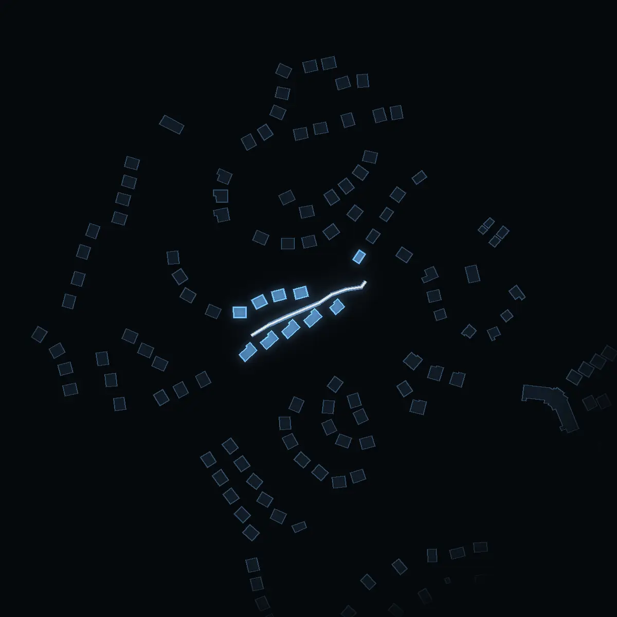 The street at night: Bäckvägen drawn in white, its buildings lit in the colour of their area’s income